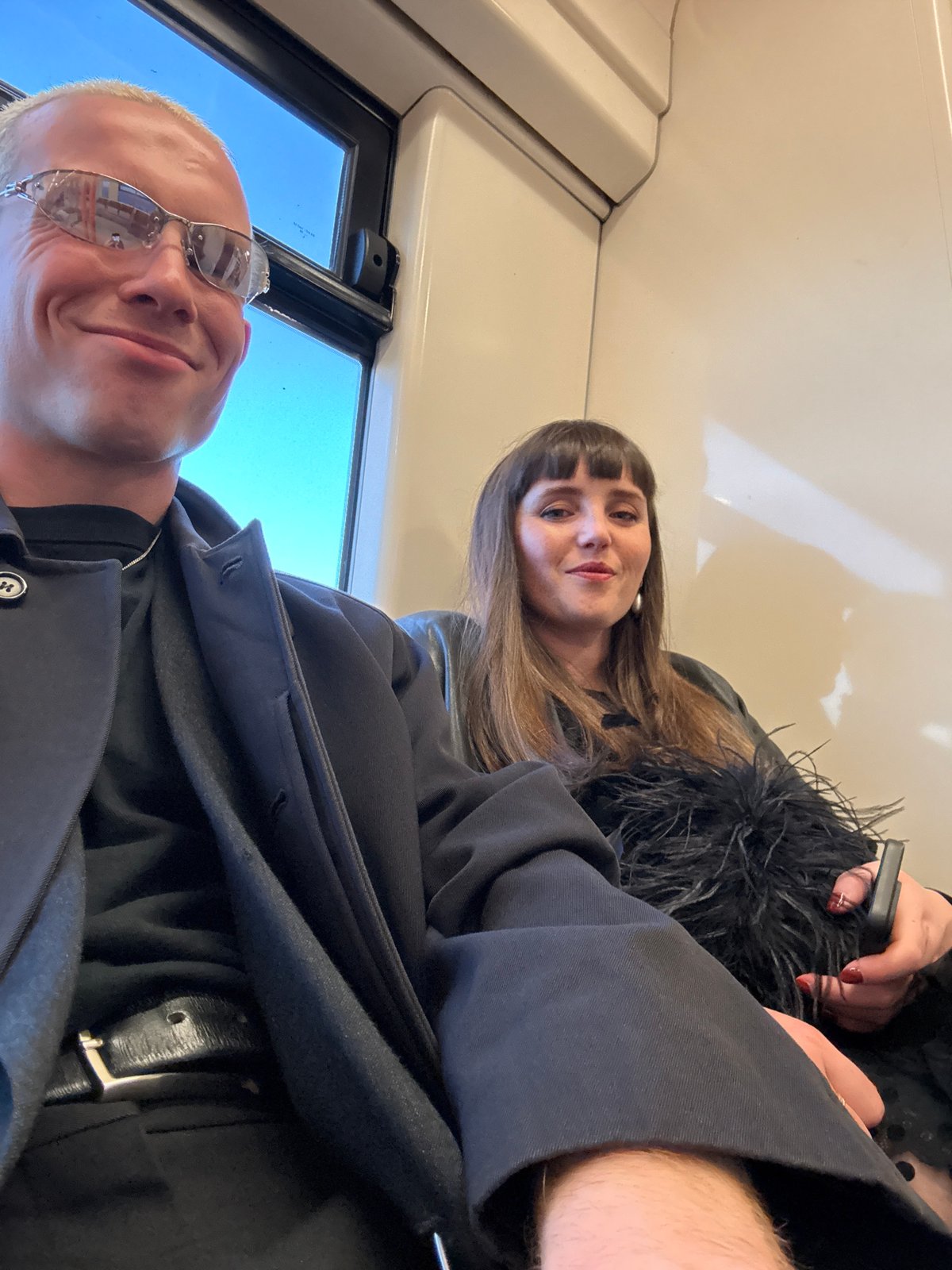 Passengers take selfie on sunny London train Friday evening