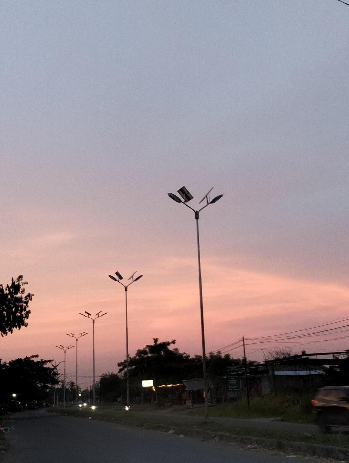 Sunset road scene photographed in Lhokseumawe, Indonesia