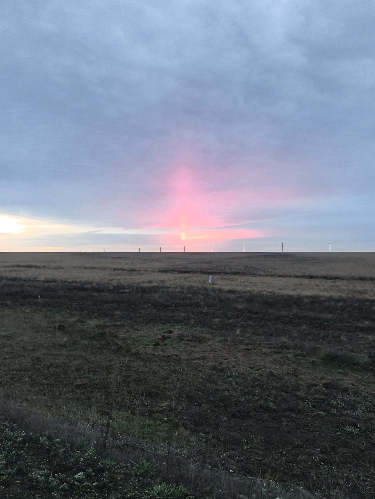 Pink light beam observed on horizon in Kazakhstan