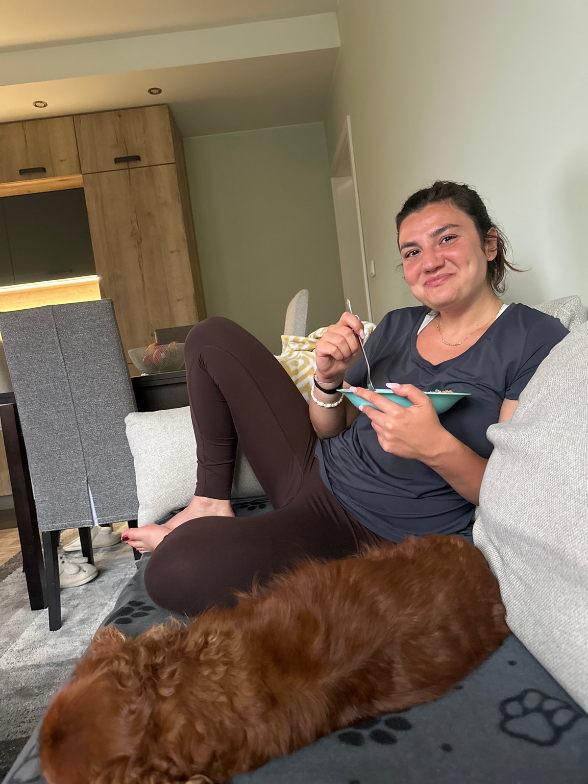 Woman and dog share quiet afternoon moment at Sofia home