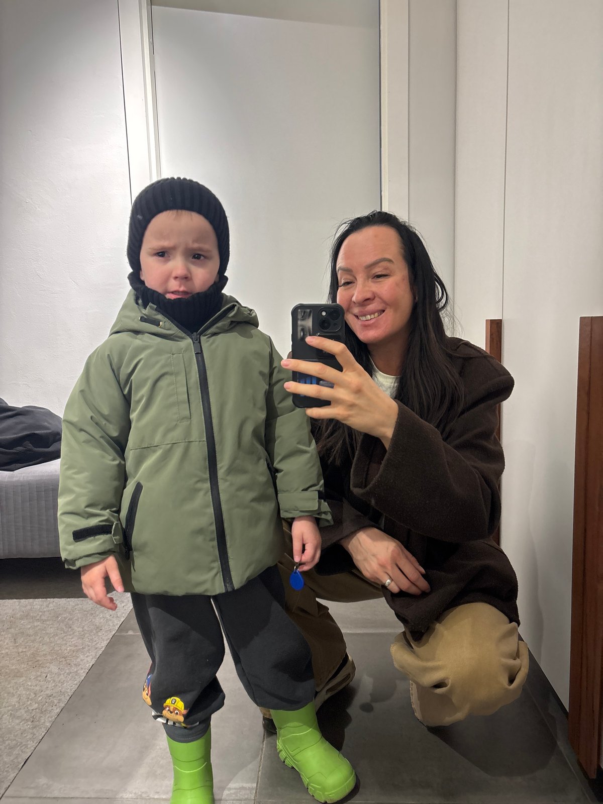 Woman and child take late-night selfies in Chaikovsky