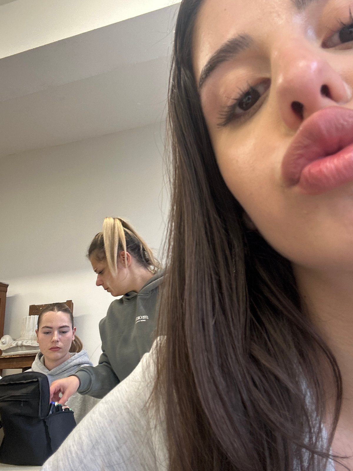 Person takes selfies, works on art project in Sofia studio