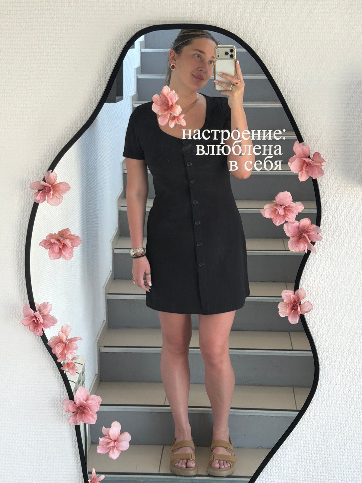 Woman takes selfies in decorative mirror in Chaikovsky