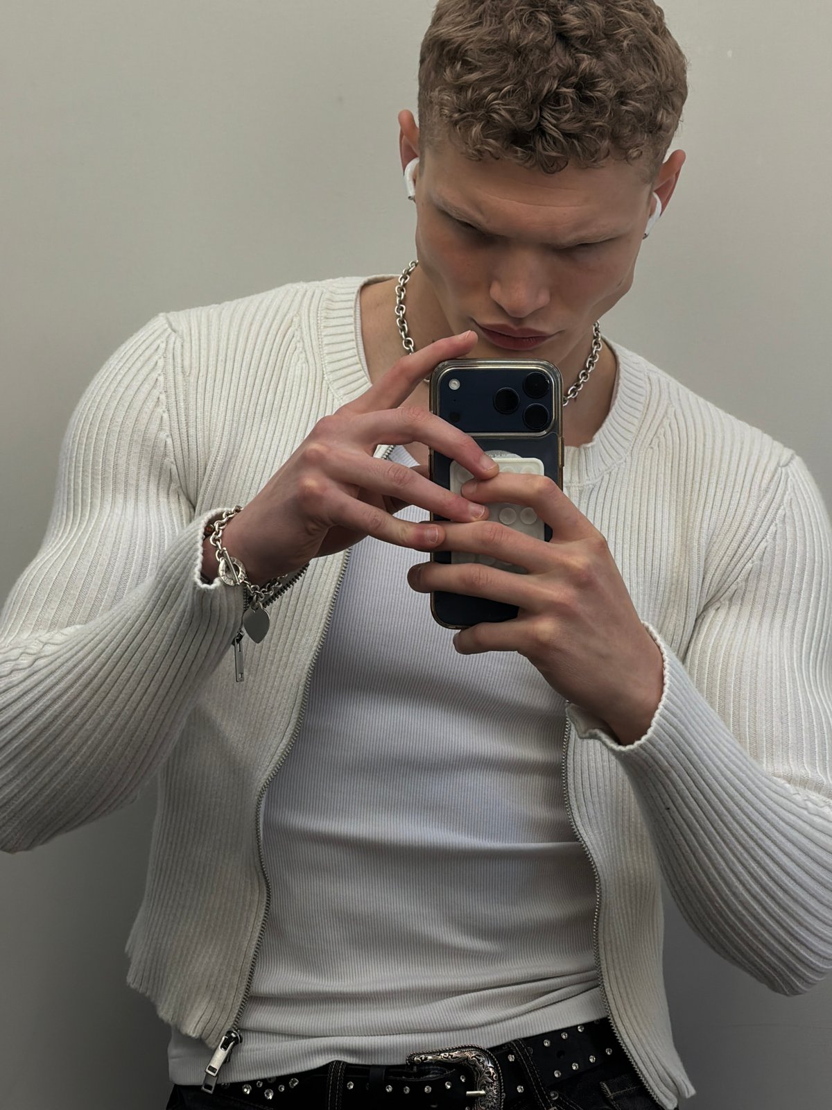 Young person takes mirror selfie in London