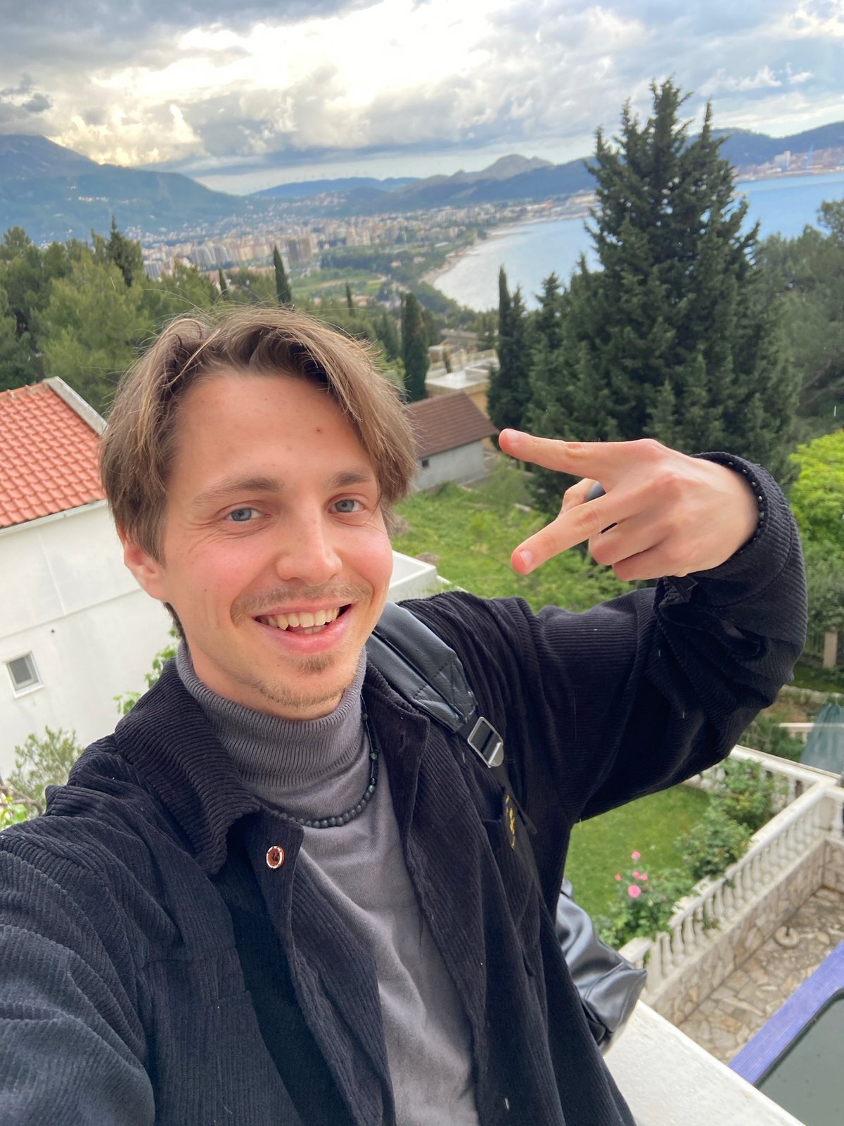 Tourist captures selfie and coastal views in Šušanj, Montenegro