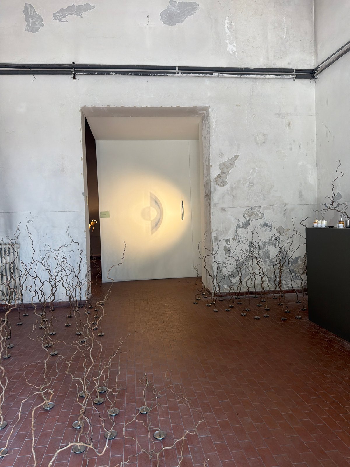 Industrial art installation documented in Milan interior space