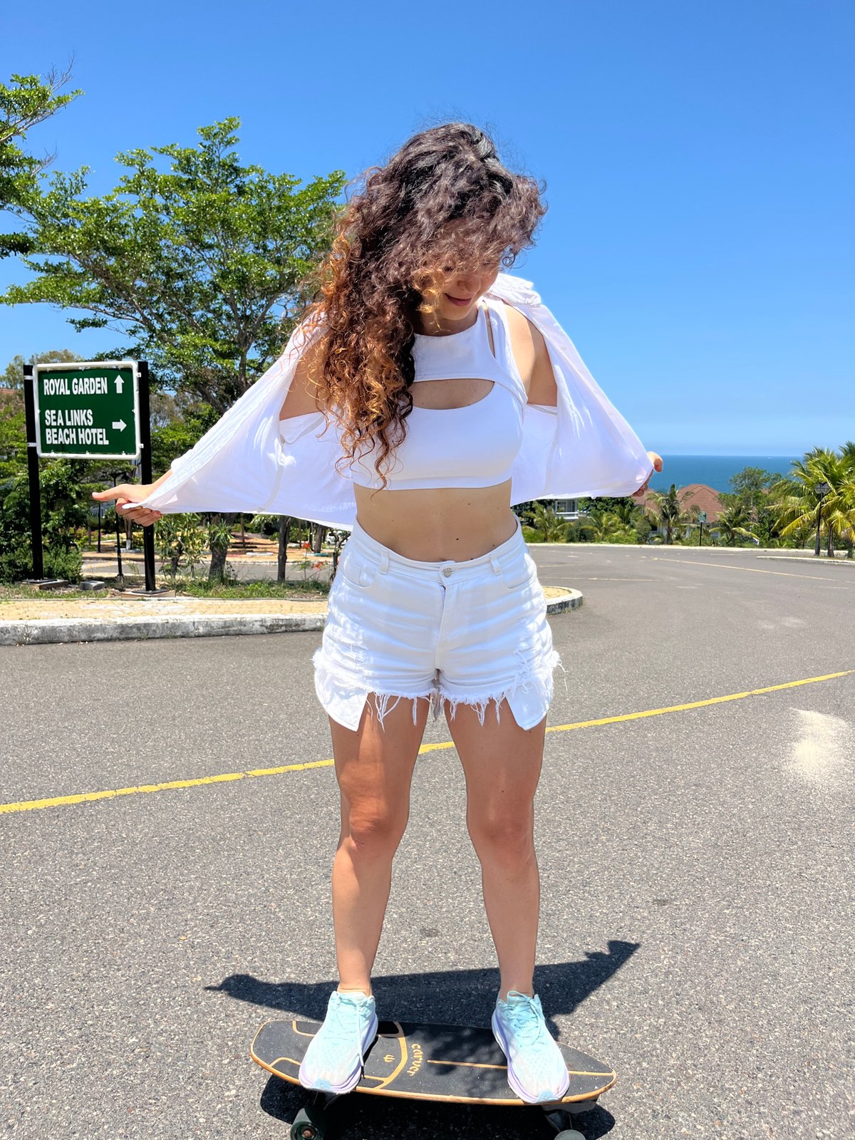 Skateboarding in all-white along the coastal roads of Phan Thiết