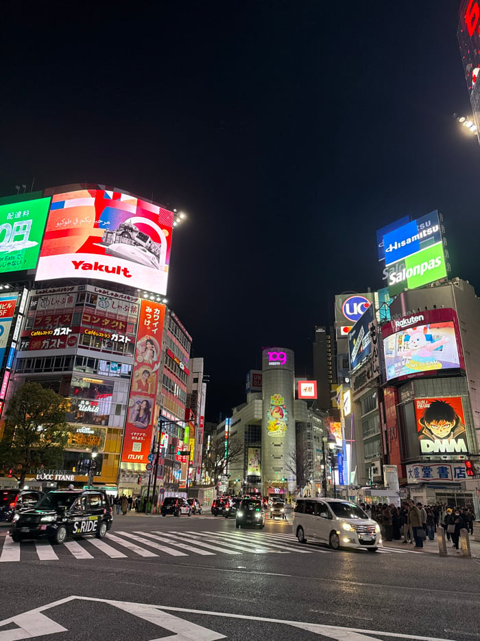Night scene documented at Tokyo's busy Shibuya intersection