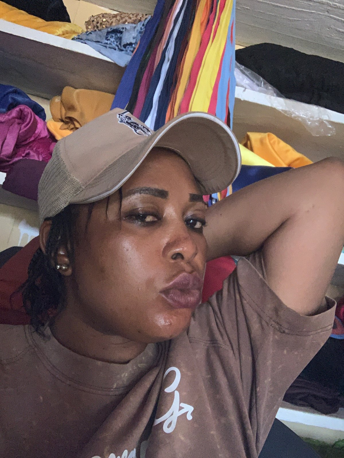 Casual indoor hangout near a small shop in Kaduna, Nigeria