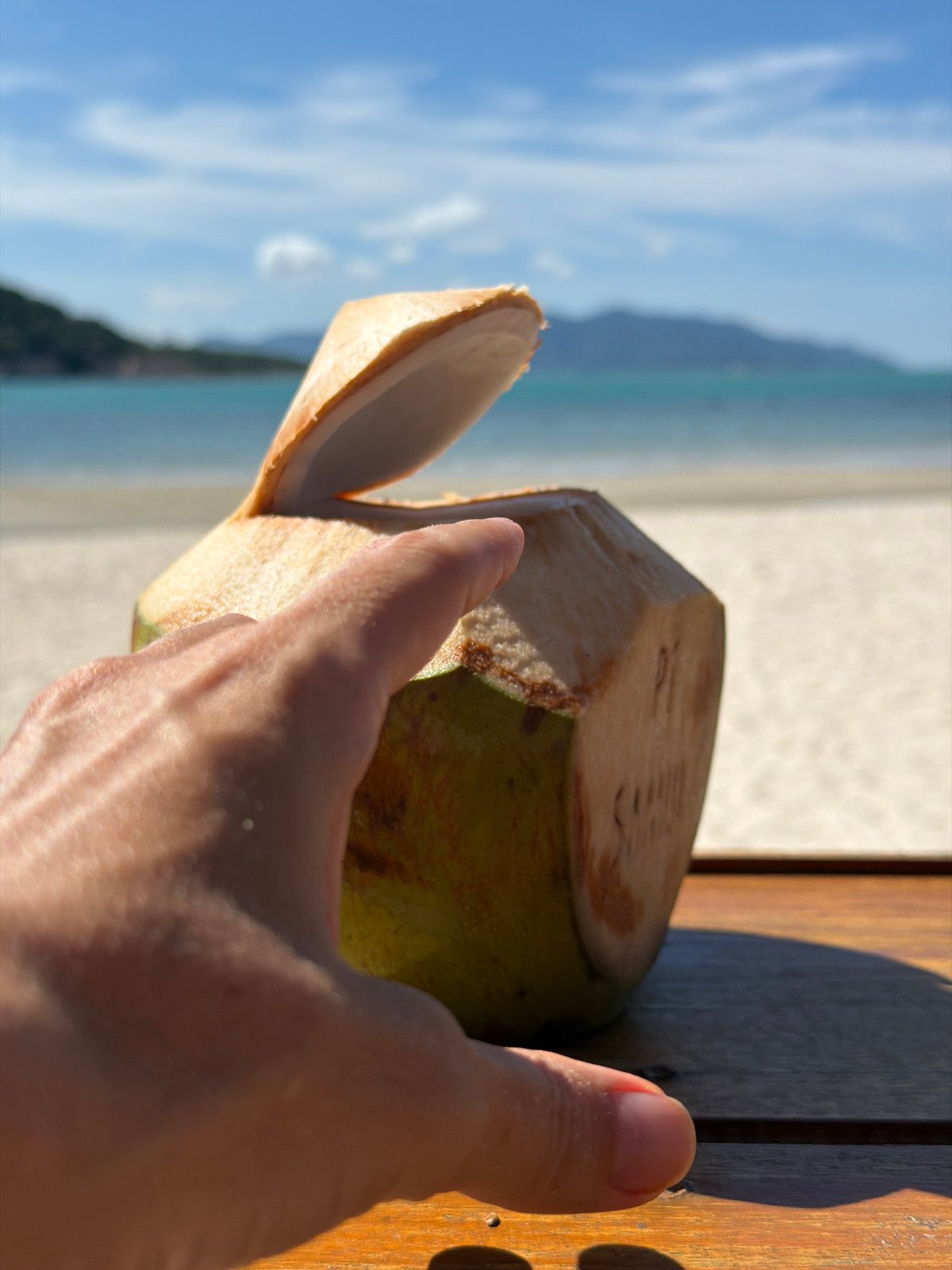 Fresh coconut cracked open beachside in Baan Plai Laem