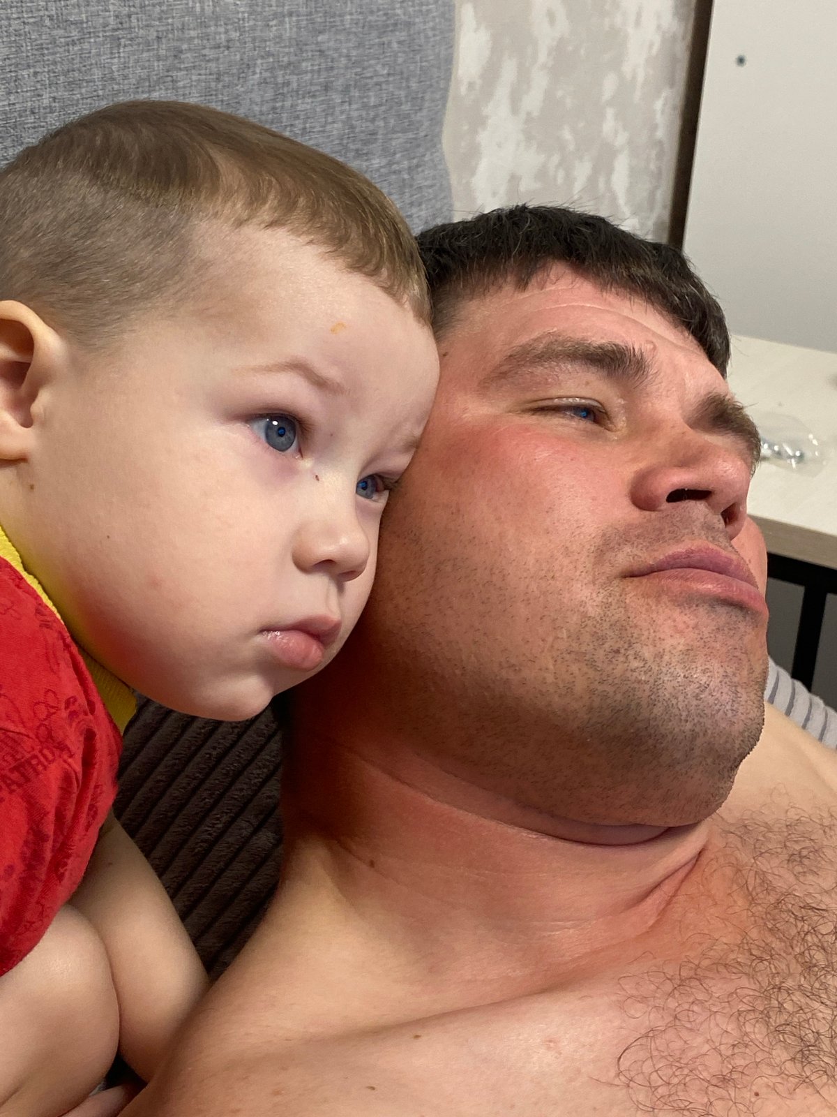 Father and child share quiet moments in Sochi home