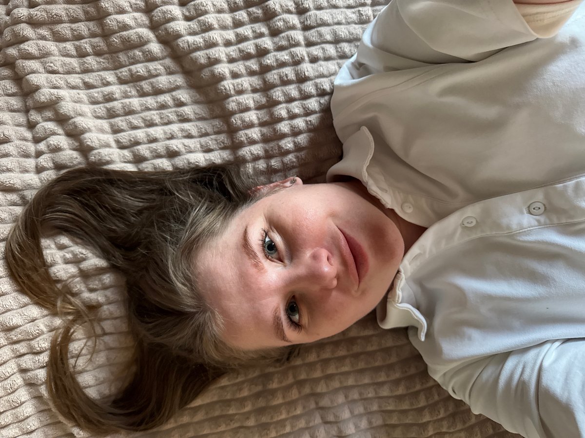Woman photographed on bed in Gornyi, Russia