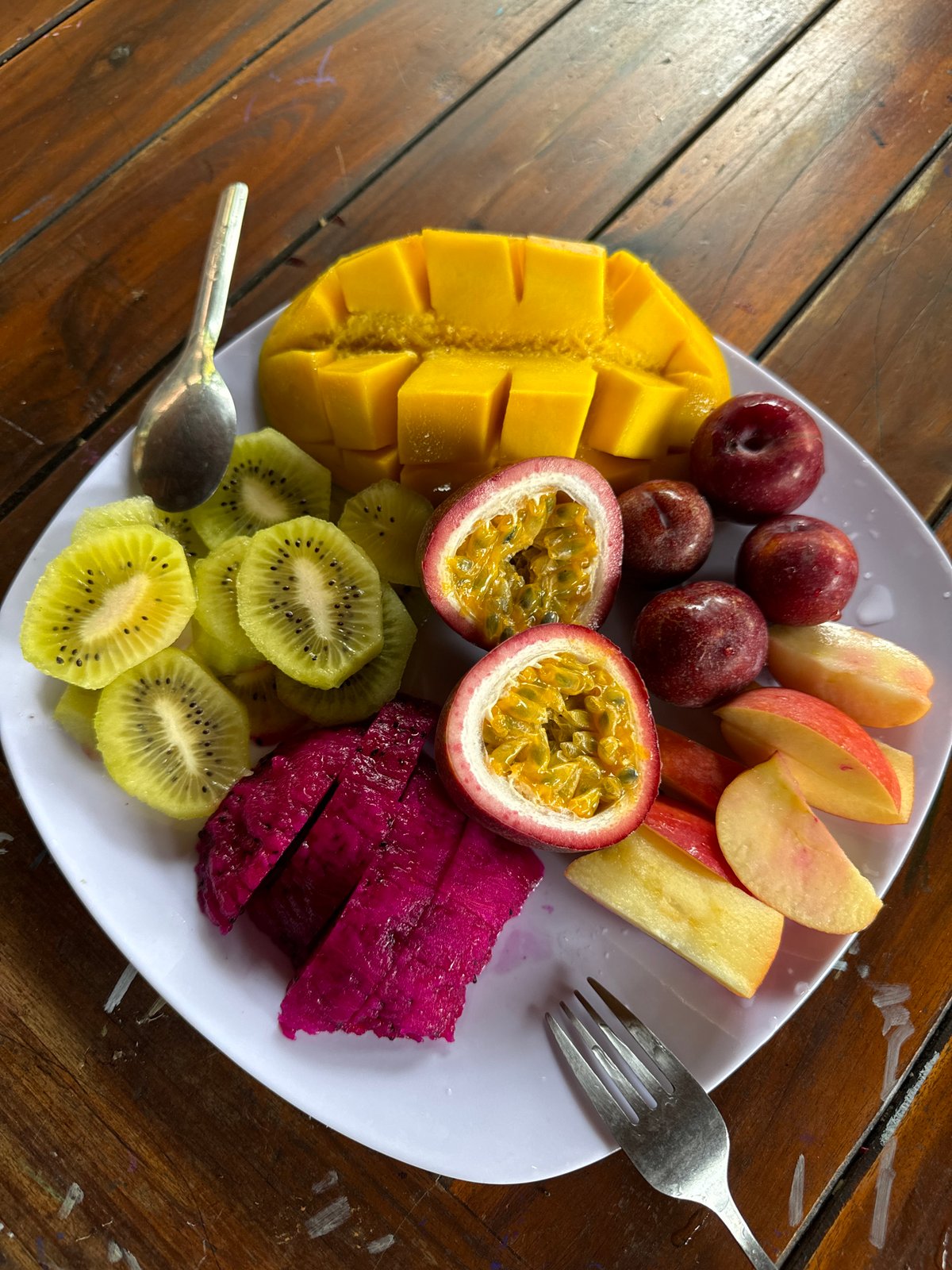 Family enjoys tropical fruit breakfast in Mũi Né, Vietnam