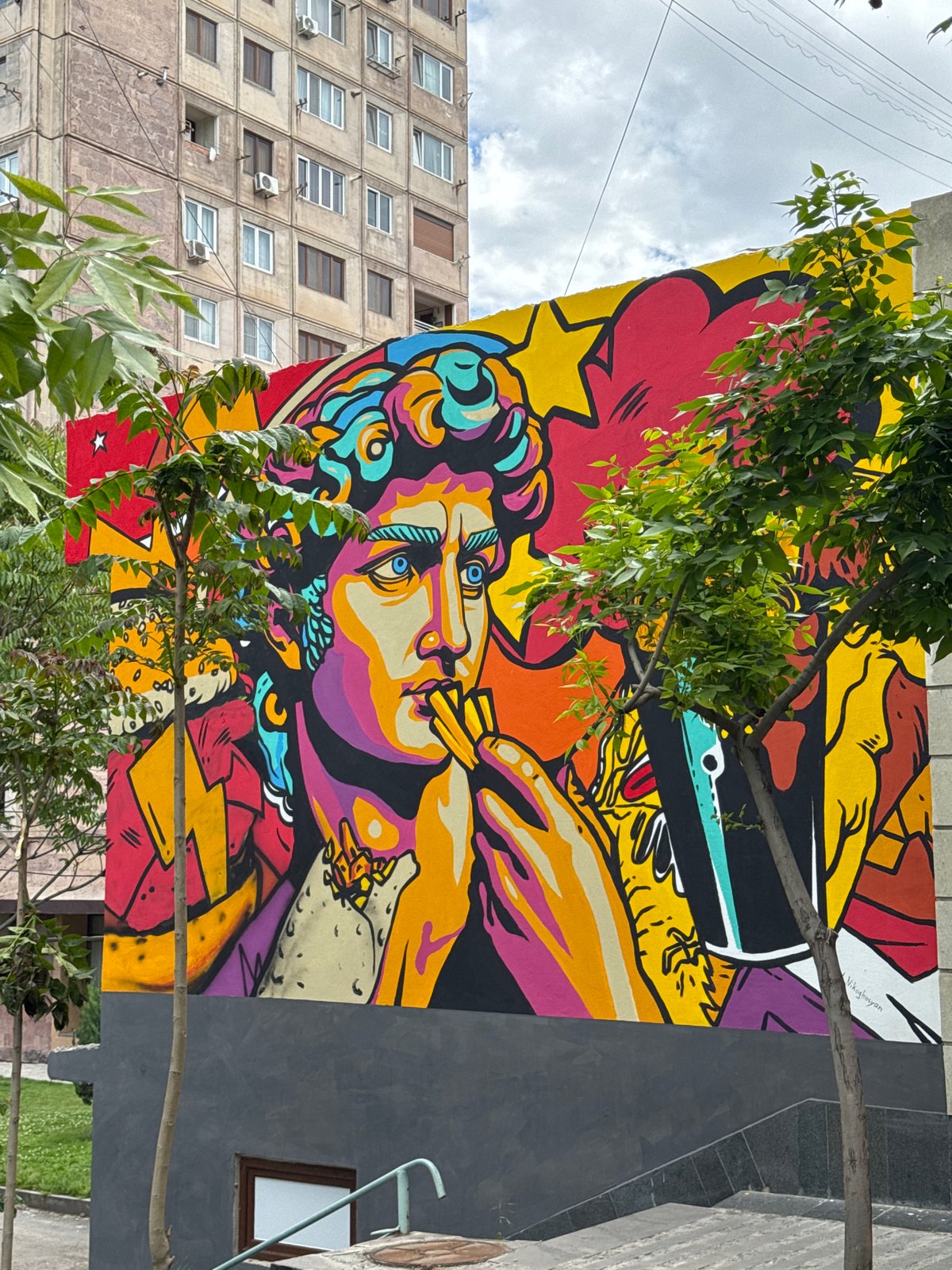 Vibrant smoking portrait mural spotted on Yerevan building