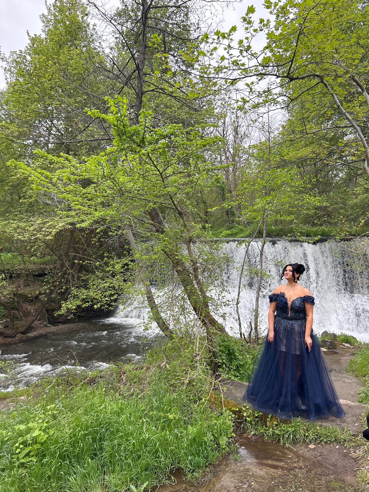 Woman in blue gown observed at waterfall near Parvenets