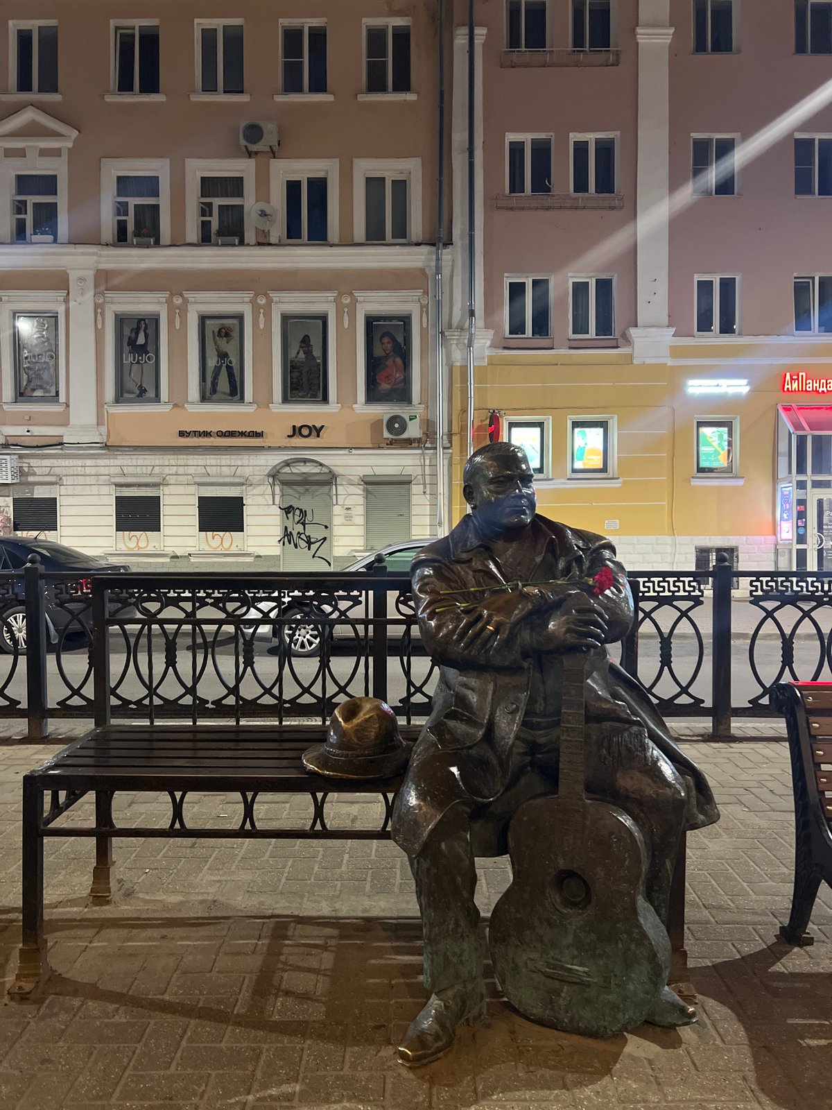 Masked musician statue with guitar and rose, Tver