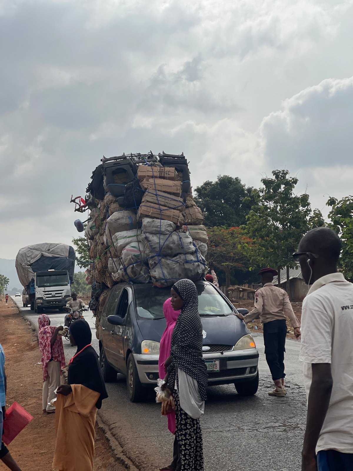 Overloaded sedan carries towering cargo in Gidan Waya, Nigeria