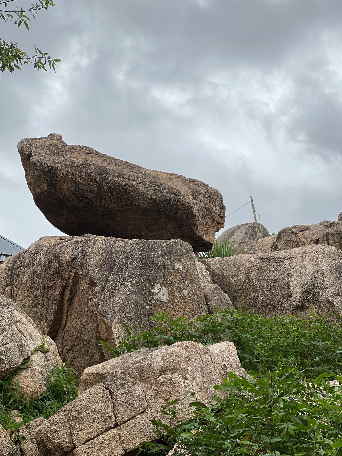 Exploring Jos's granite boulder landscape with city views below