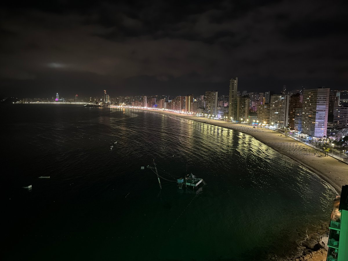 Night photography captures Benidorm's illuminated crescent bay coastline