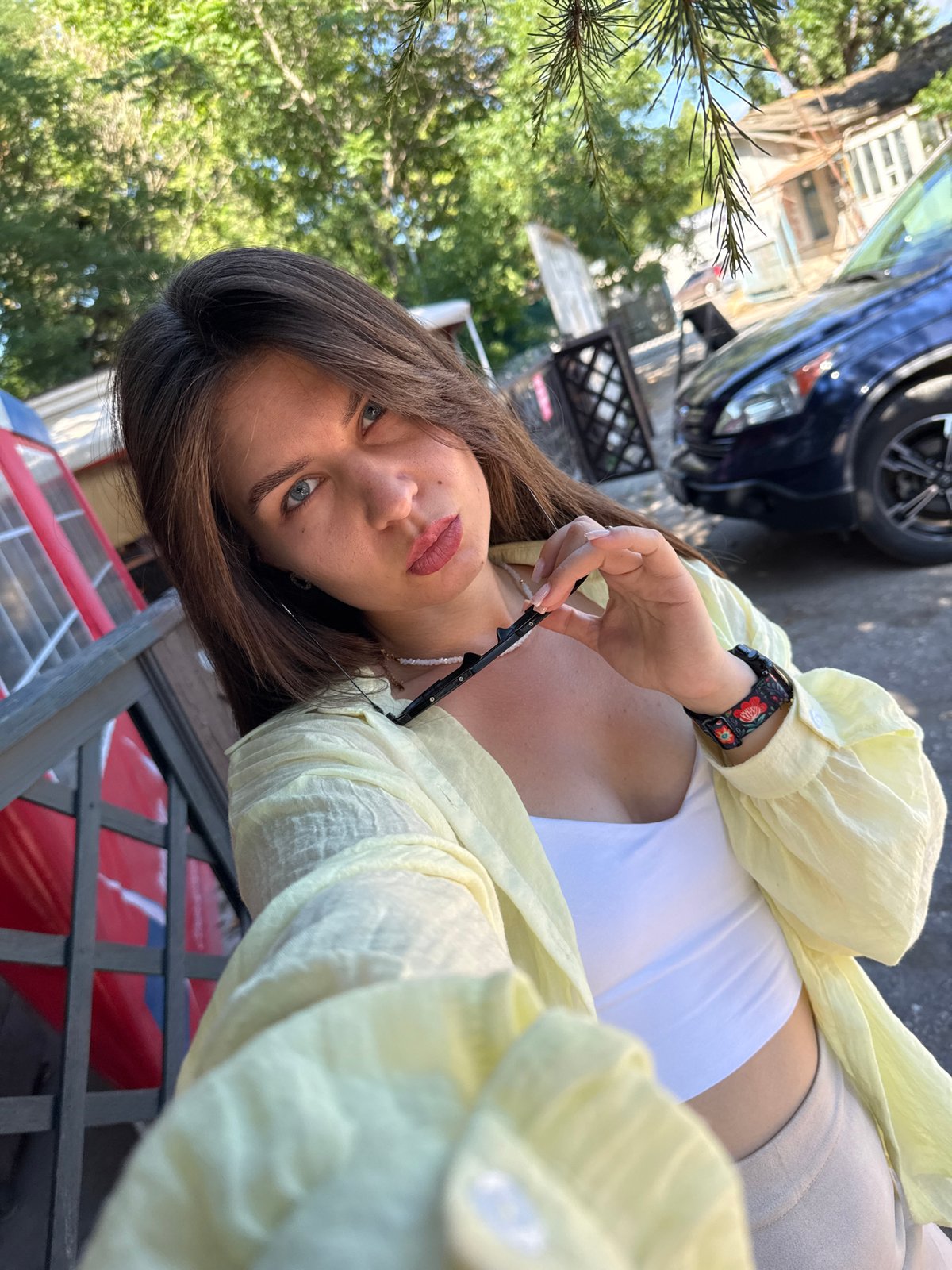 Outdoor selfie session in yellow shirt on a sunny day