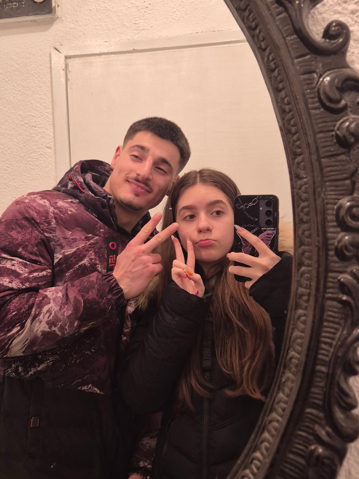 Couple cooks dinner together, documents evening with selfies