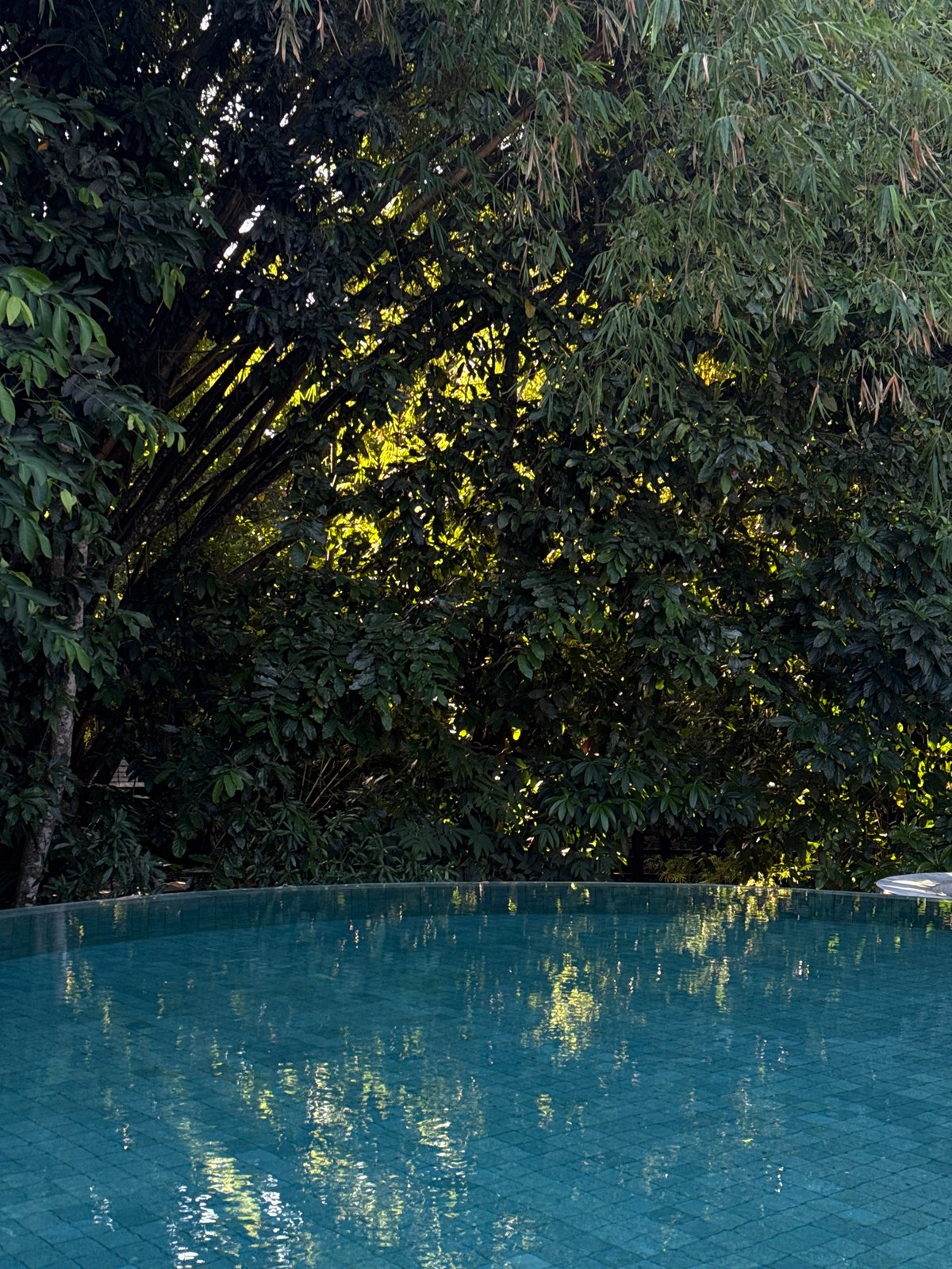 Wandering a bamboo-and-thatched Balinese complex by the coast