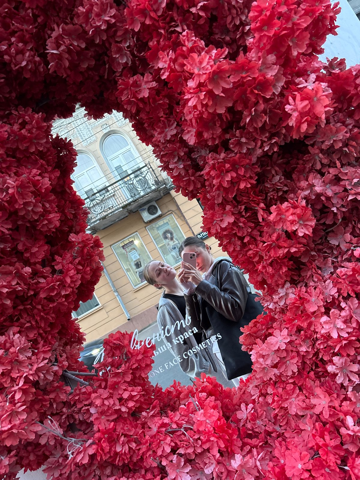 Woman takes selfie during sunset in Ternopil, Ukraine