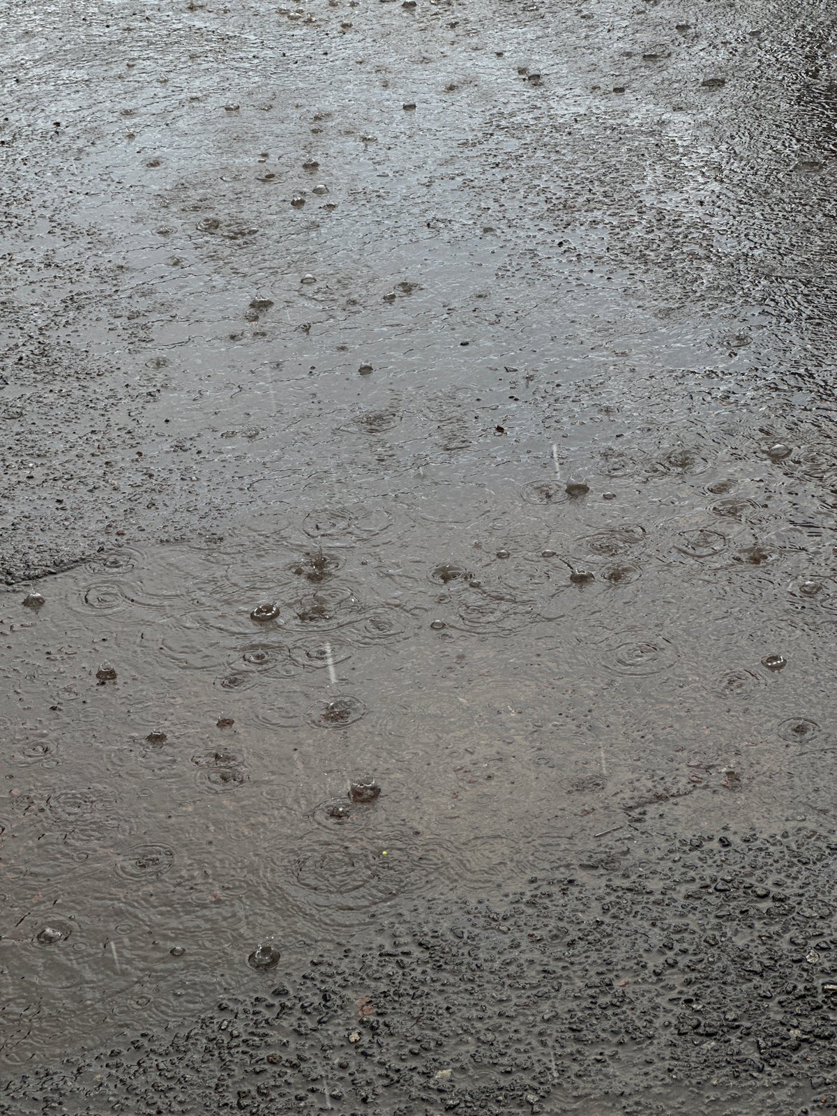 Midday rain shower hits the streets of Kokshetau