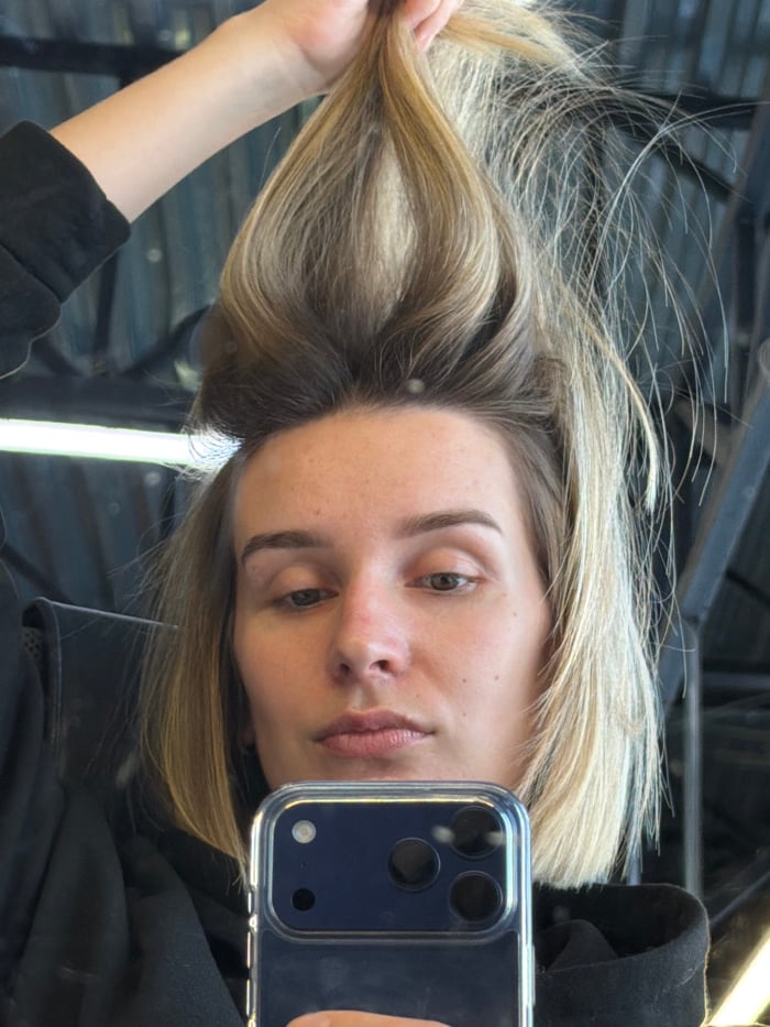 Woman documents extended selfie session in Russian industrial office