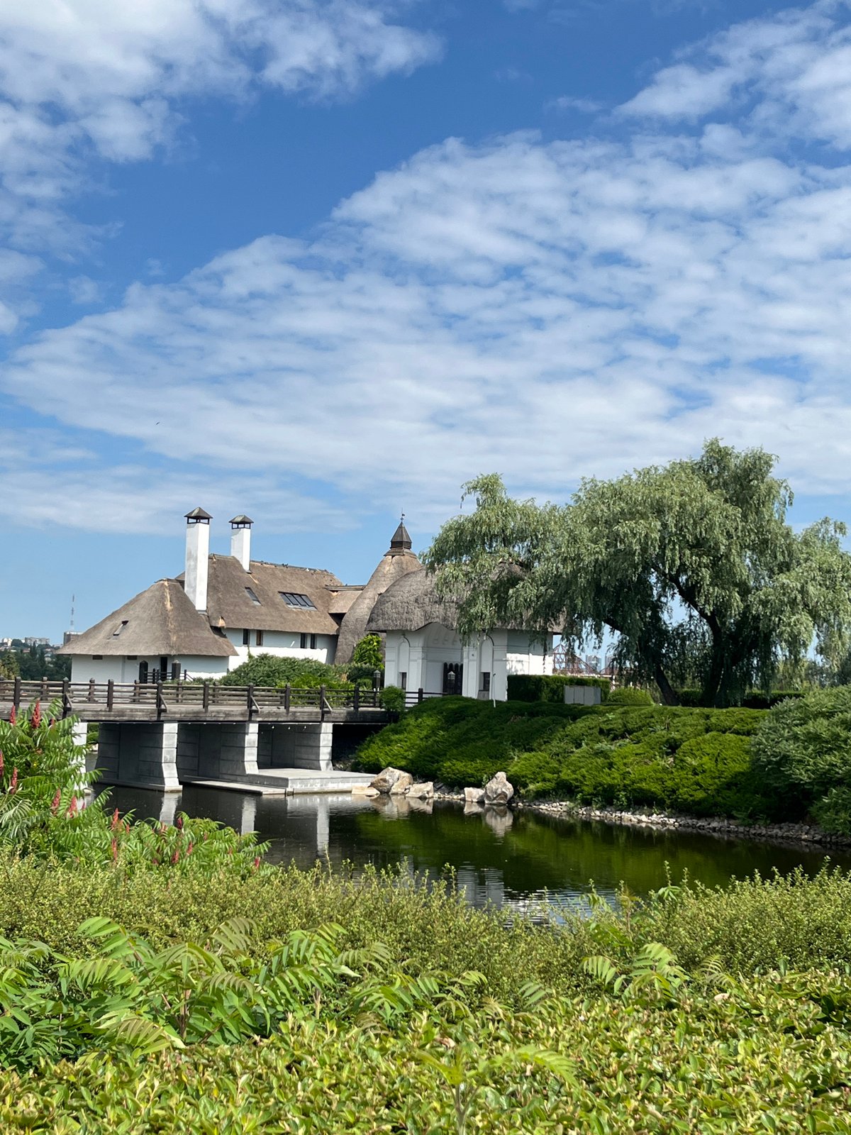Morning stroll through Dnipro Botanical Garden's grounds and thatched landmark