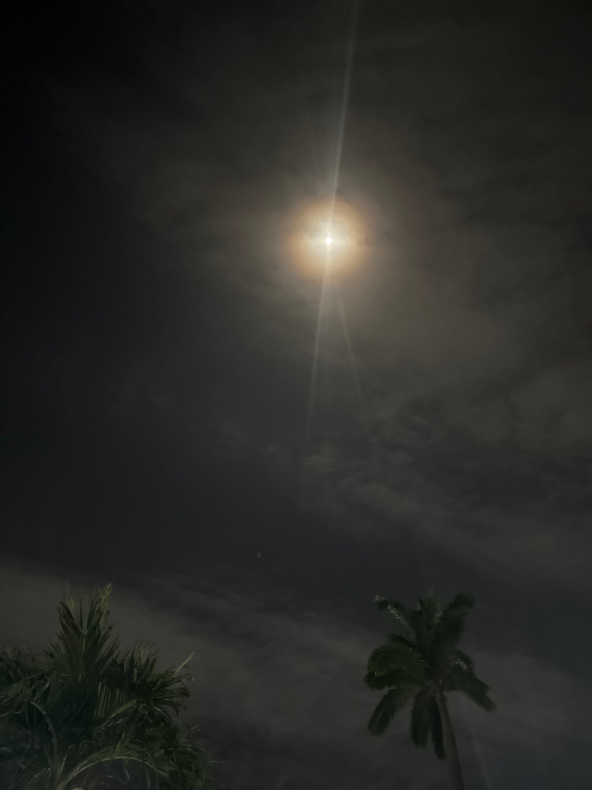 Bright light streaks observed through clouds in Rumuomasi, Nigeria