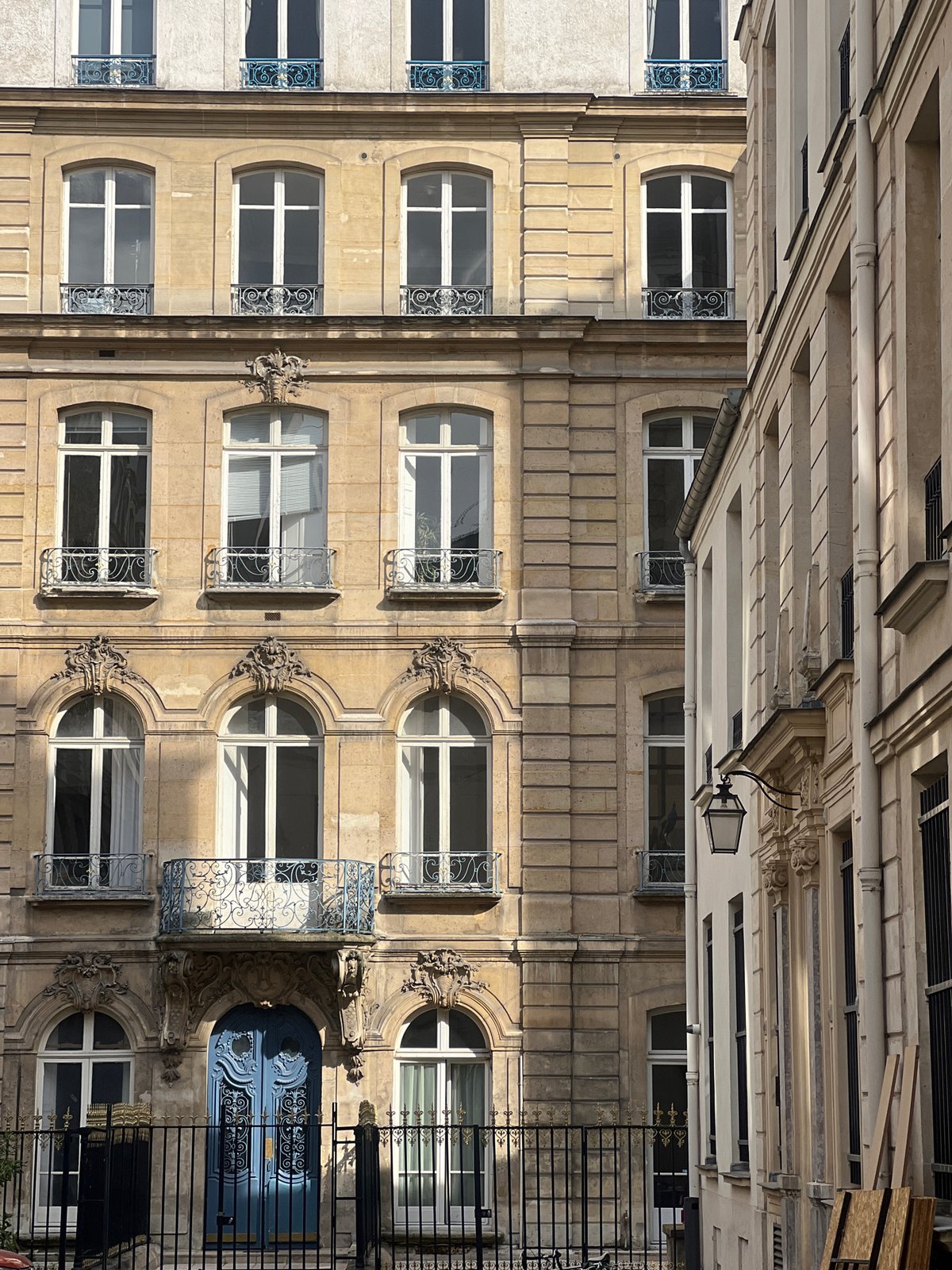 Witness documents traditional Parisian street architecture Sunday afternoon