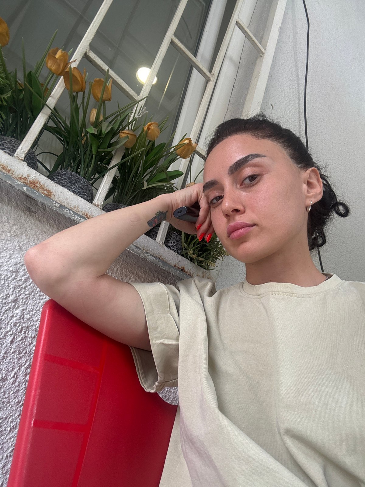 Young woman photographed multiple times during morning in Tbilisi