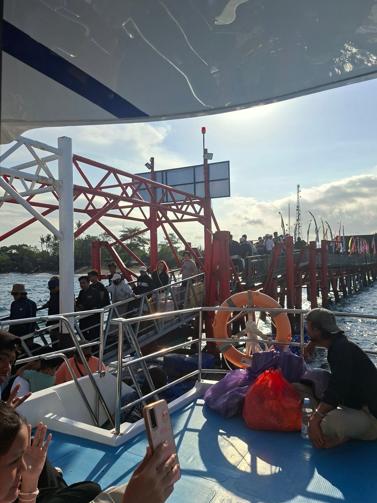 Ferry crossing near Dawan pier on a clear morning