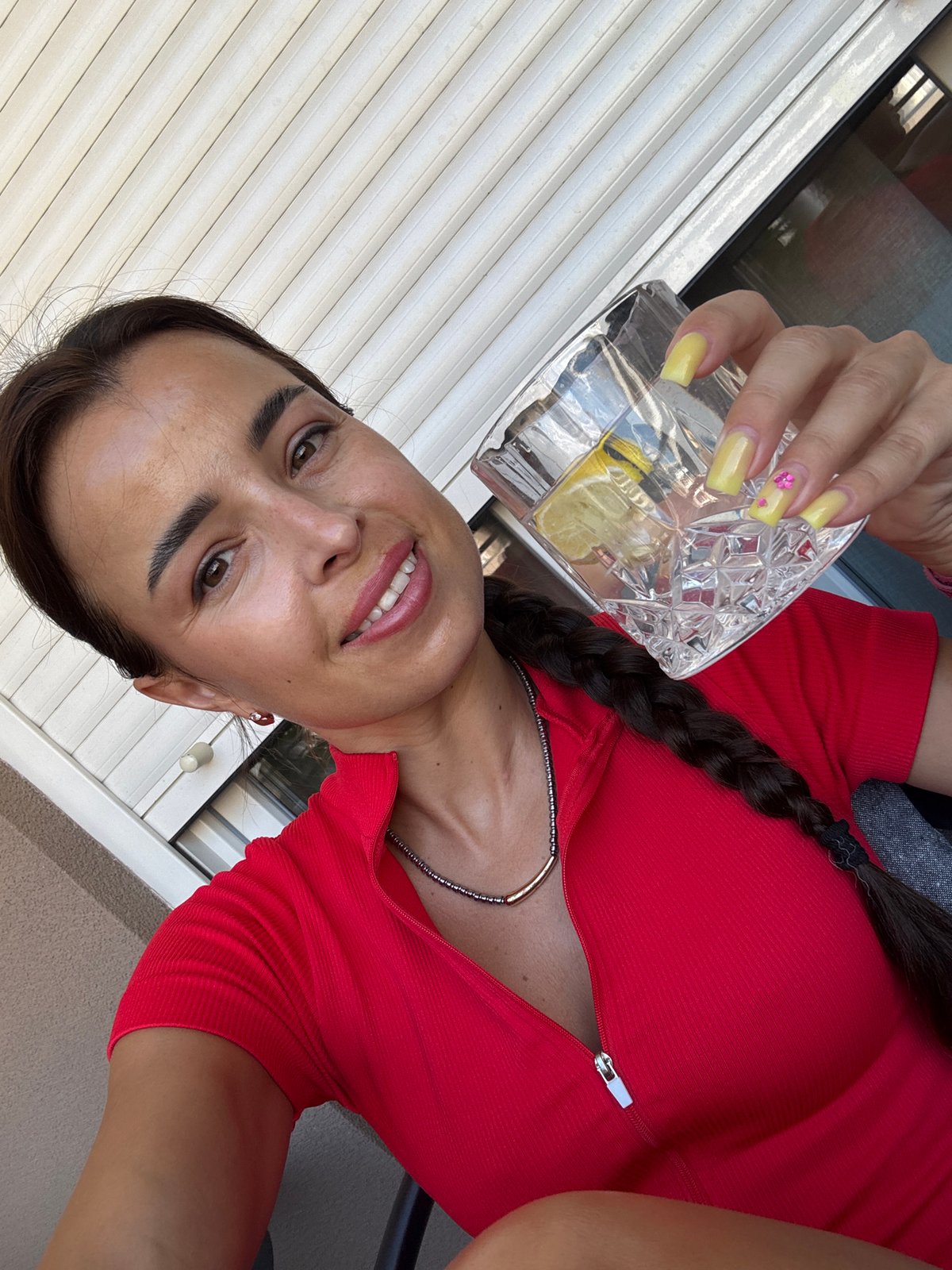 Iced lemon water on a balcony patio, summer morning