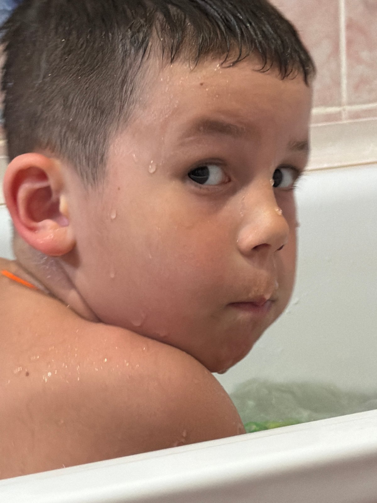 Child bathtime documented in Chaikovsky home bathroom