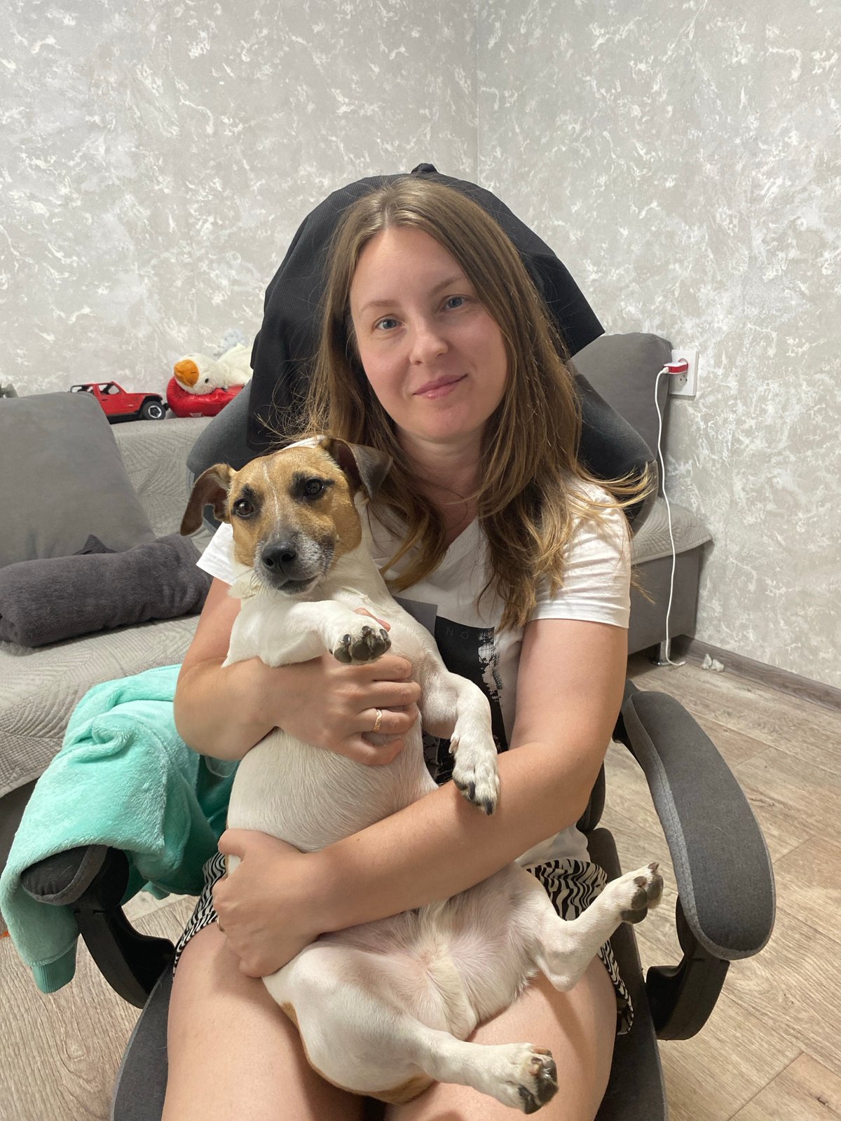 Woman enjoys morning with pets amid snowfall in Noviy