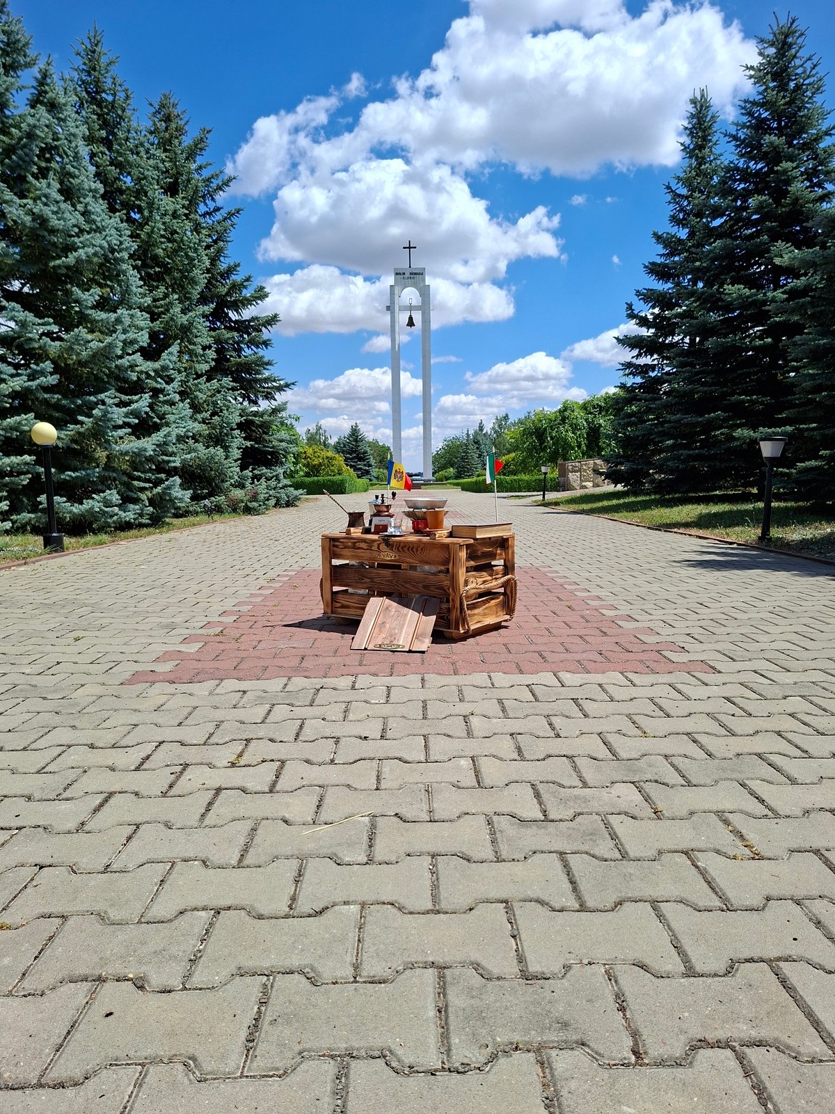 Rustic coffee setup near a bell tower in Șerpeni, Moldova