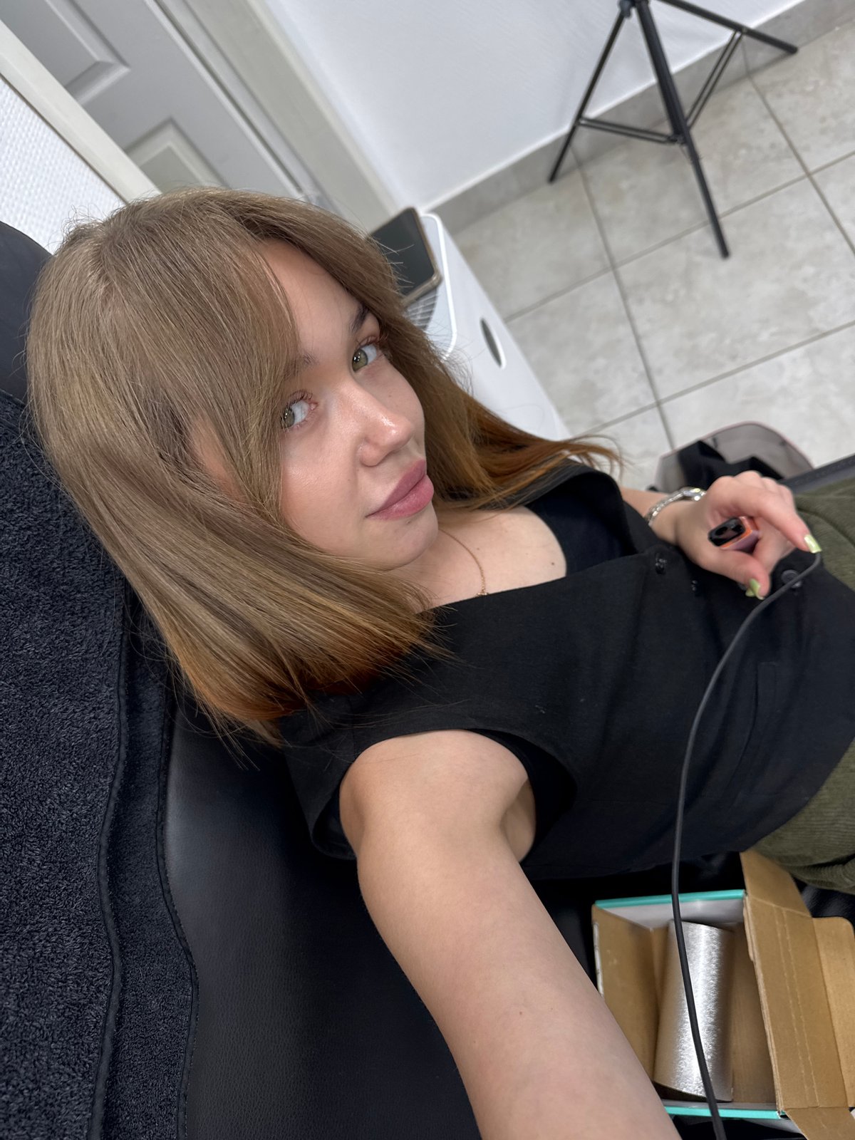 Woman Documents Hair Salon Visit With Selfies in Chaikovsky