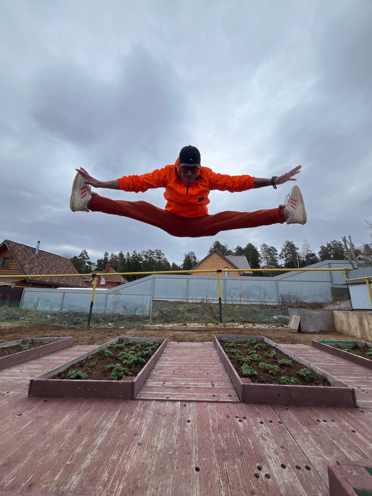 Man performs morning acrobatics routine in Russian backyard