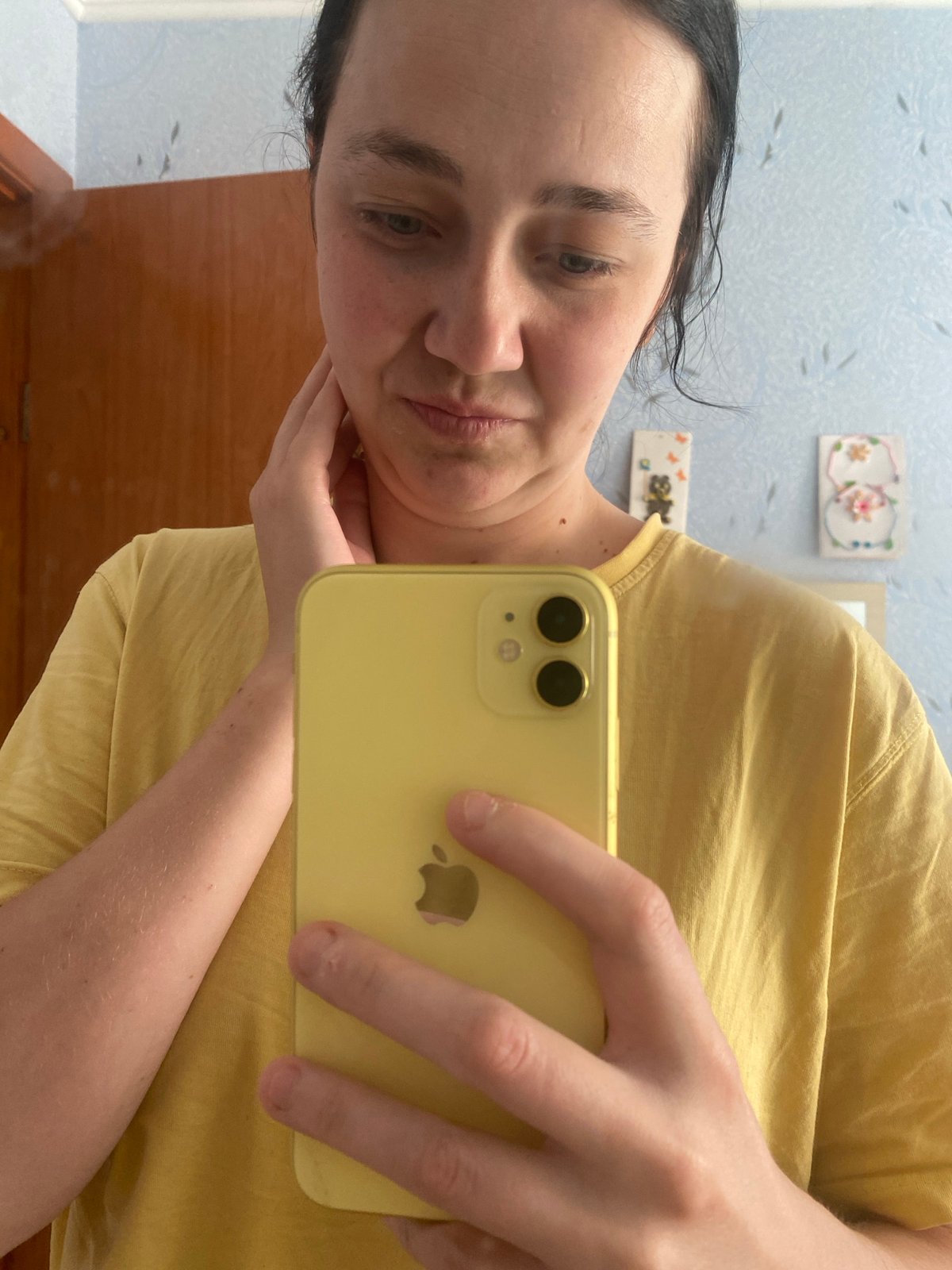 Casual bedroom selfie session with a child nearby