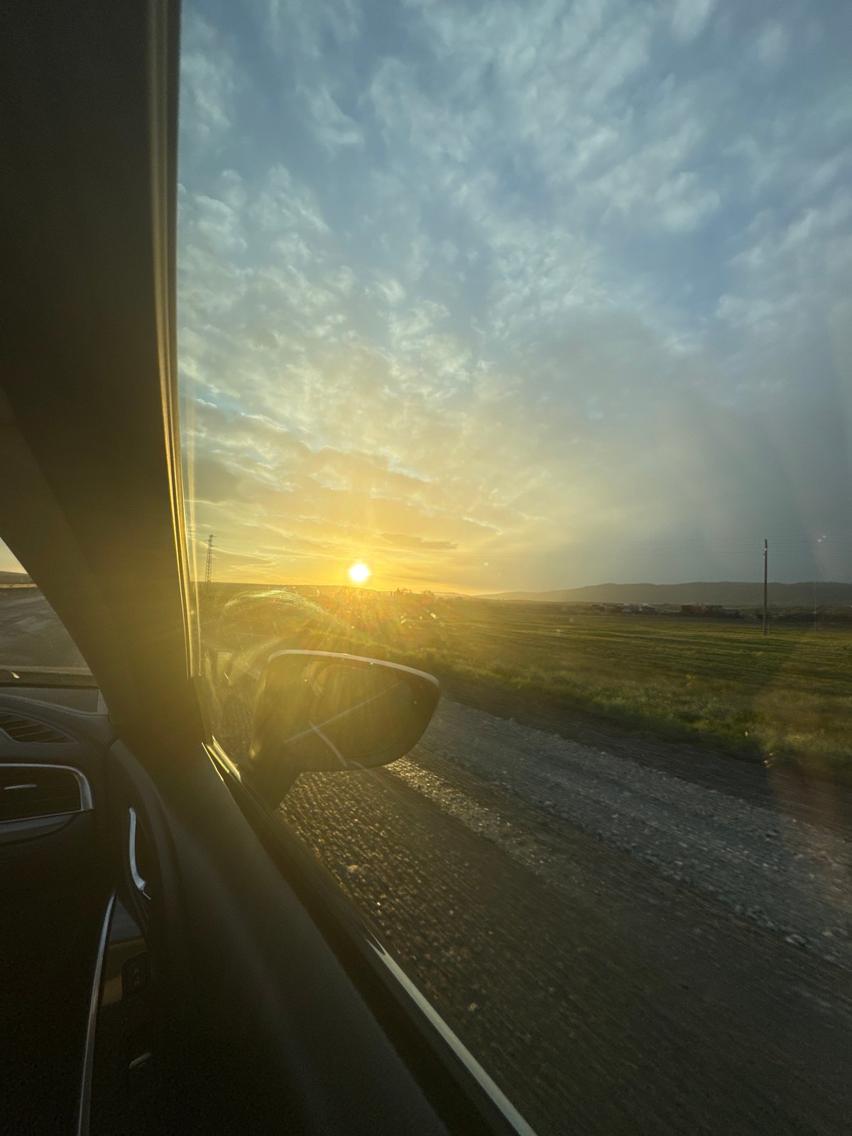 Driver captures sunset view through windshield in Aytos, Bulgaria
