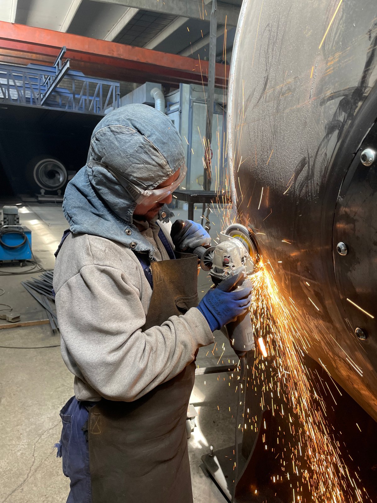 Welder works on metal object in Zaljevo, Montenegro