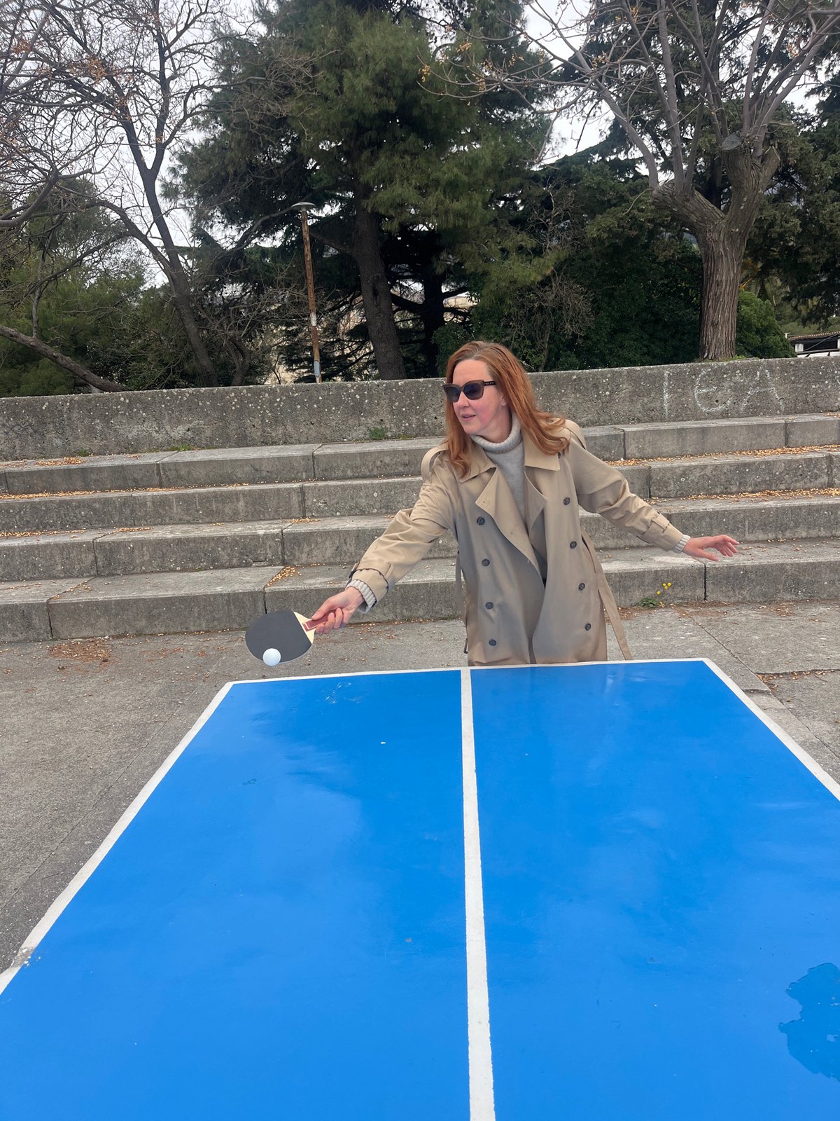 Woman plays outdoor ping pong in Budva Montenegro