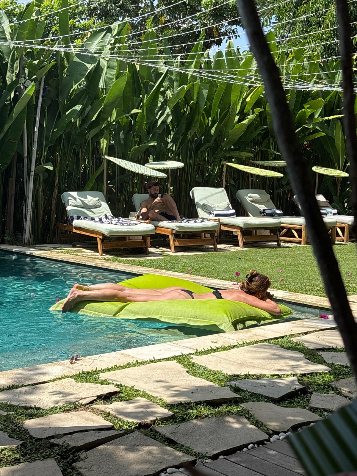 Couple enjoys morning pool time in Kuta Selatan