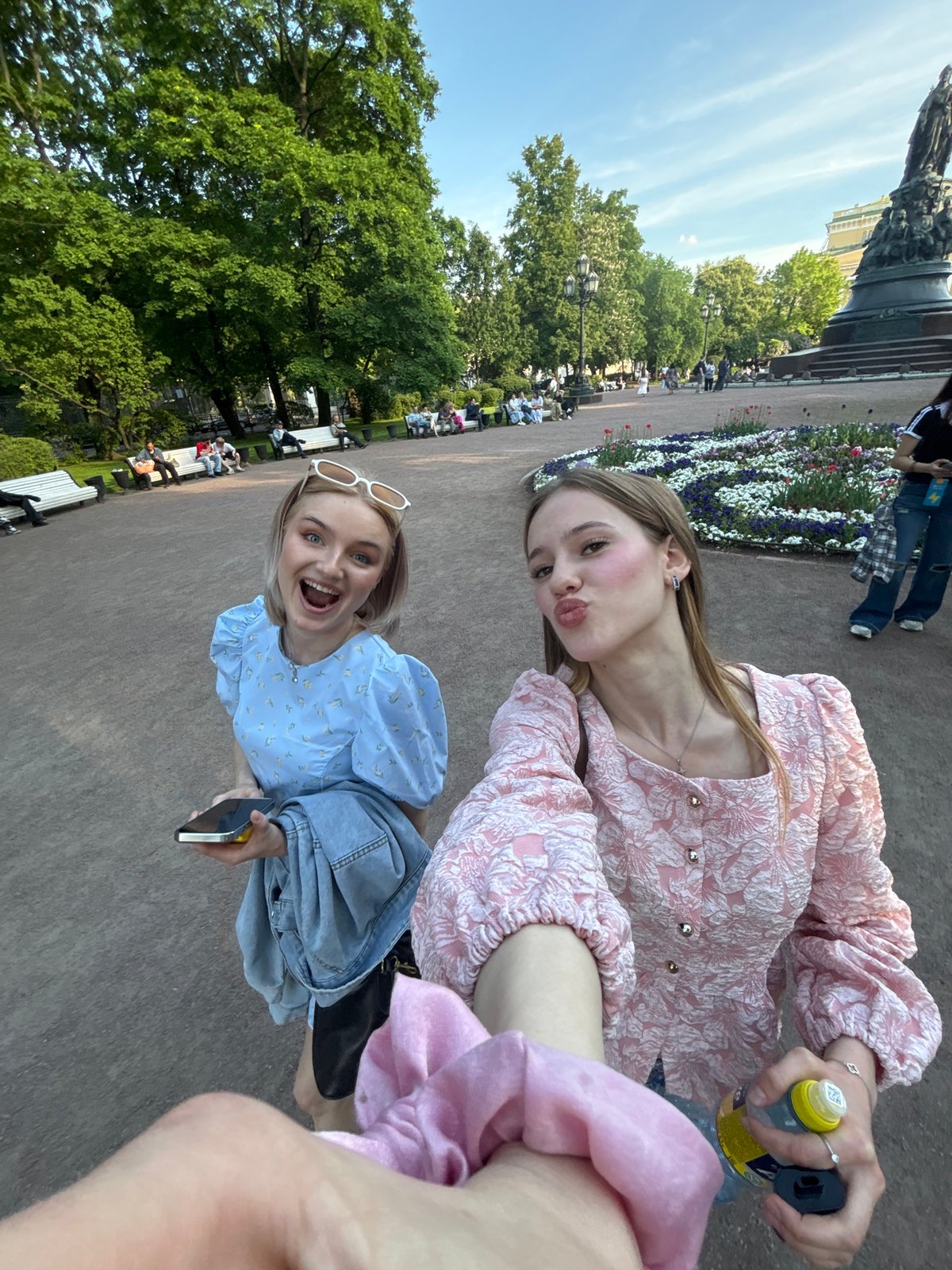 Tourists document afternoon sightseeing tour through central Saint Petersburg landmarks