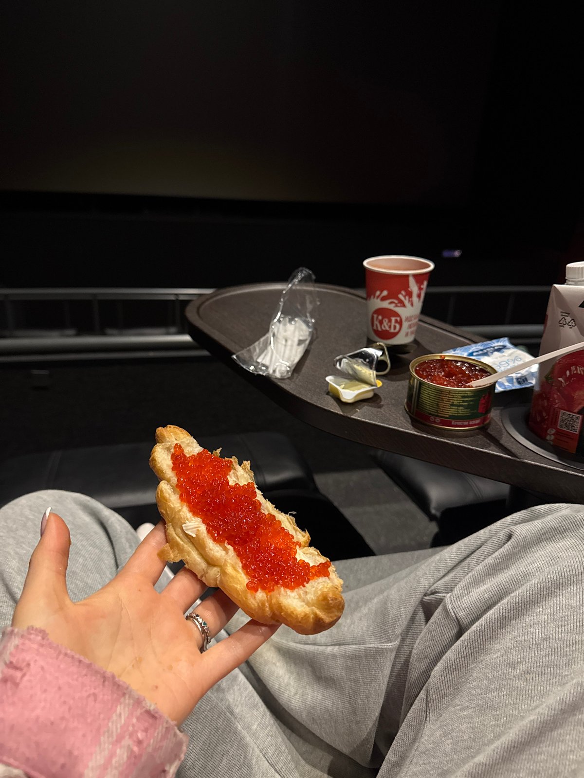 Moviegoer enjoys red caviar snack in Moscow theater