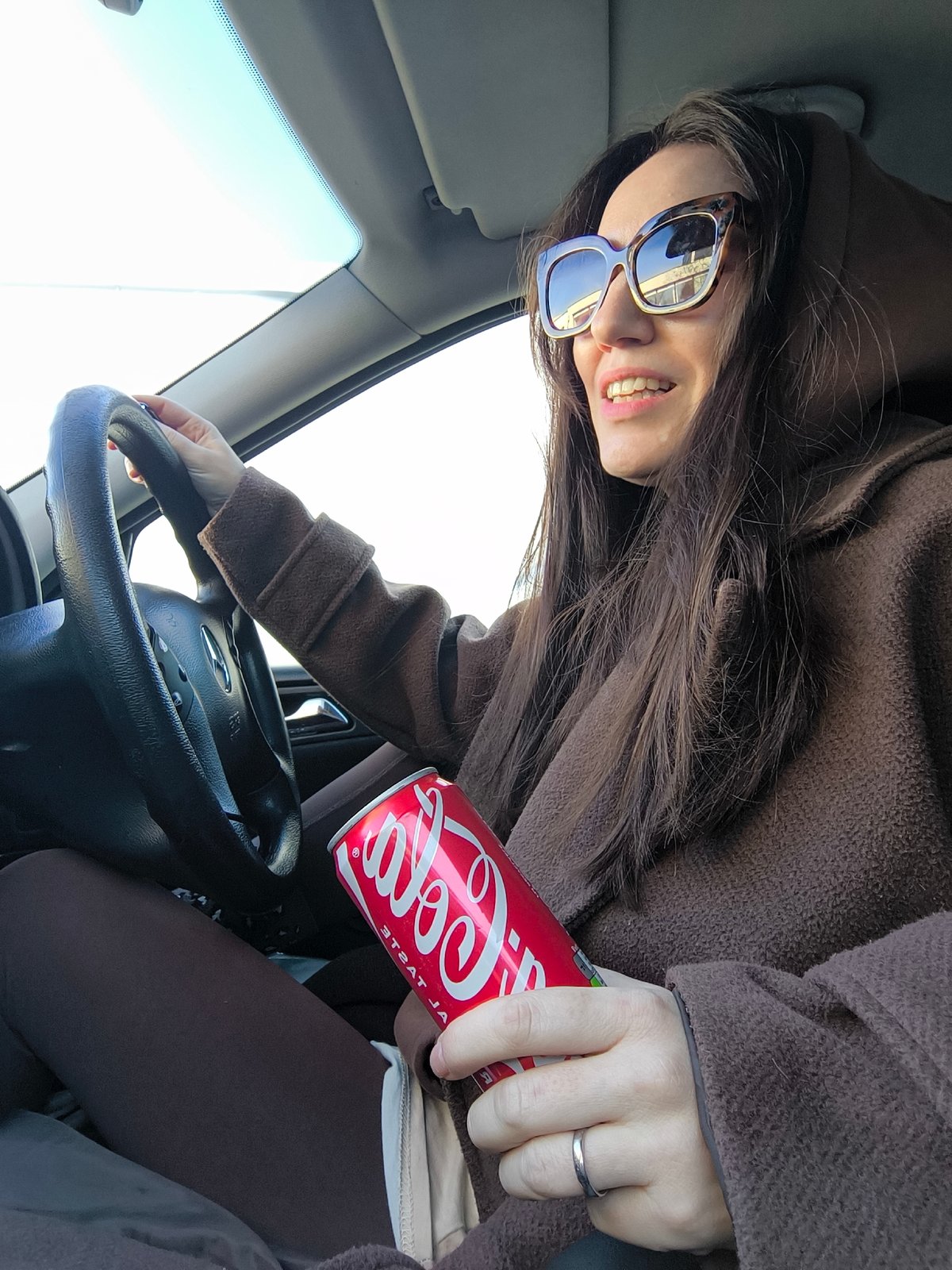 Woman in tortoiseshell sunglasses spotted in car in Riga