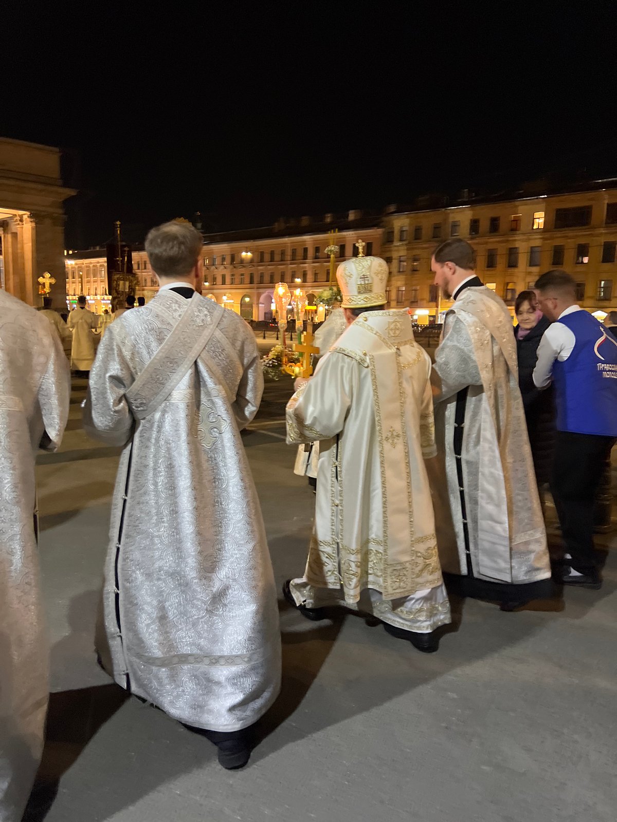 Nighttime religious procession with candles held in Saint Petersburg