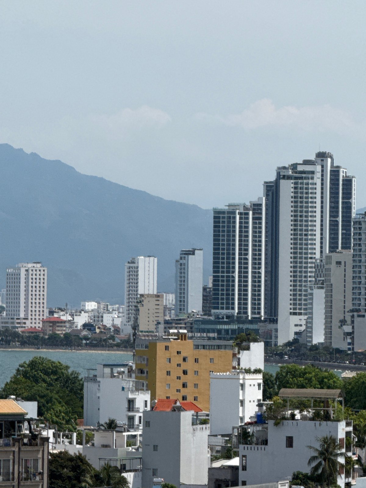 Nha Trang hillside neighborhood, morning street and rooftop life